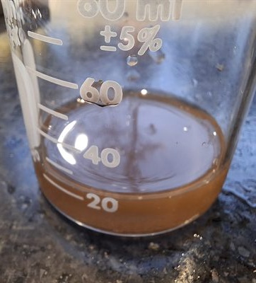 Filtered glucose solution in a graduated beaker